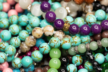 Different colorful beads. Macro shot. Selective focus.