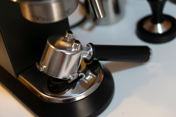 Professional coffee machine making espresso in a cafe