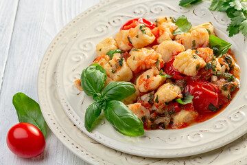 Traditional potato gnocchi with tomato sauce.