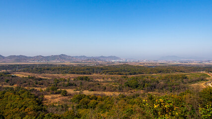 Fototapeta na wymiar A view across the DMZ from the Dora Observatory to North Korea