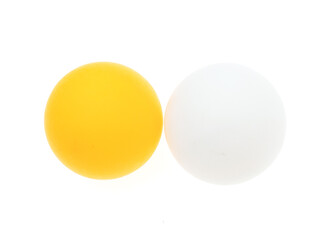 White and orange ping pong ball on a white