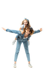 mother imitating plane with daughter on back isolated on white