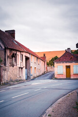 Old houses in France village with cornfield