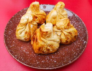 Fried khinkali on a red table