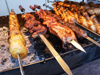Shish kebab on skewers is fried on coals