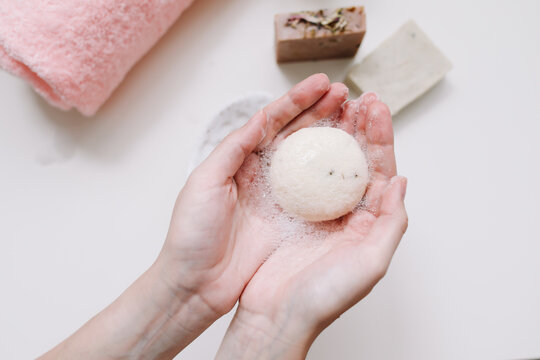 Close up of hand hold soap for cleaning. Hygiene. Cleaning Hands. Women hands with natural organic soap. Top view