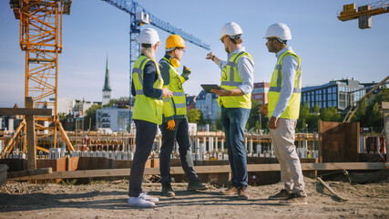 Diverse Team of Specialists Use Tablet Computer on Construction Site. Real Estate Building Project with Civil Engineer, Architect, Business Investor and General Worker Discussing Plan Details.