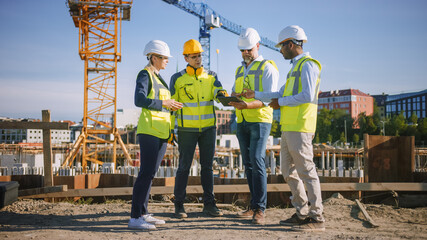 Diverse Team of Specialists Use Tablet Computer on Construction Site. Real Estate Building Project with Civil Engineer, Architect, Business Investor and General Worker Discussing Plan Details.