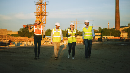 Diverse Team of Specialists Taking a Walk Through Construction Site. Real Estate Building Project with Senior Civil Engineer, Architect, Business Adviser and General Worker Discussing Casual Topics.