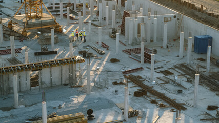 Aerial Shot of a New Constructions Development Site with Diverse team of Engineers and Architects...