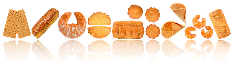 Sweet and fresh baked goods in row with soft reflection isolated on white