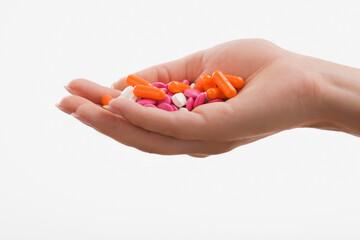 Close-up of a human palm holding pills