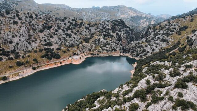 Aerial shot flying over the Gorg Blau, an artificial reservoir on the Tramuntana mountains, Mallorca