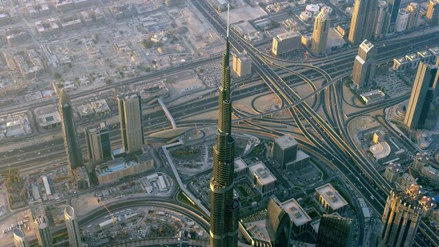 A breathtaking aerial view of Business district of Downtown Dubai hovering over the world's tallest building in the world Burj Khalifa, 6-axis stabilized gimbal, Shotover F1, 8K, parallax.