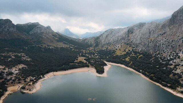 Aerial establishing shot of the Gorg Blau reservoir on a moody day in Mallorca