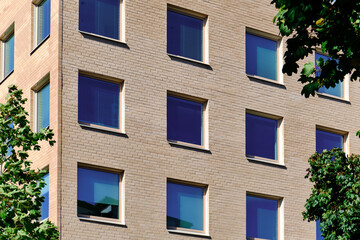 Obraz premium The blue windows in the brick wall. Modern Nordic architecture.