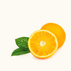 The orange is isolated. Whole fruit and half with leaves on a white background.