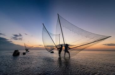 Shadow fishermen in the early morning.