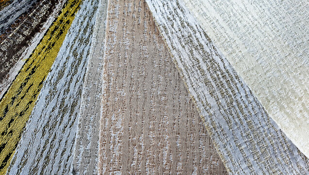 various color of textile pattern silk fabric samples. luxury interior fabric curtain background.