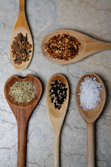 High angle view of spices in wooden spoons