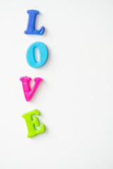the word love is laid out in colored letters on a white background