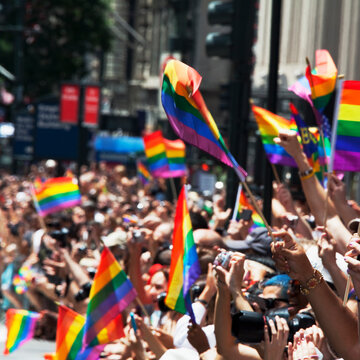 People carrying rainbow flags in gay pride parade, New York City, New York State, USA