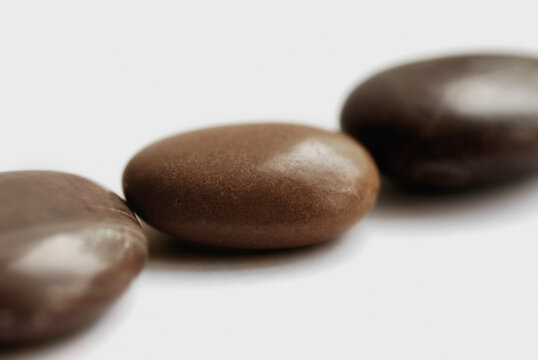 Close-up of three pebbles in a row
