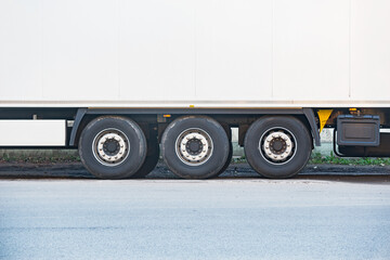 Fototapeta na wymiar Wheels of the long heavy freight truck.