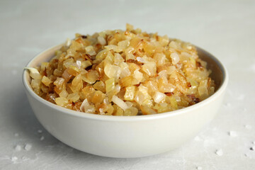 Tasty fried onion on grey marble table, closeup