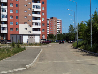 Fototapeta na wymiar New apartment buildings. Kazakhstan (Ust-Kamenogorsk). New residential area. Bright modern architecture