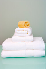 Fototapeta na wymiar Bath sponge on towels