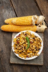 Closeup of Spicy Corn or Maize Kernel in a Plate with Dry Maize in Vertical Orientation
