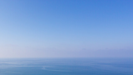 Blue water seascape abstract background. Clear blue sky