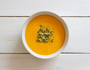 Pumpkin cream soup with seeds, pistachios, sesame seeds and spices. Healthy eating. Vegetarian food.