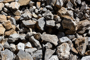 Fototapeta na wymiar Gray large rock stones and debris background