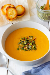 Pumpkin cream soup with seeds, pistachios, sesame seeds and spices. Healthy eating. Vegetarian food.