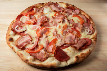 pizza with salami and tomatoes