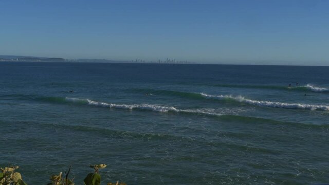 Tourists surfing the calm waves - Snapper Rocks Gold Coast QLD Australia