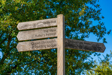 Wooden sign post with directions in Epping Forest
