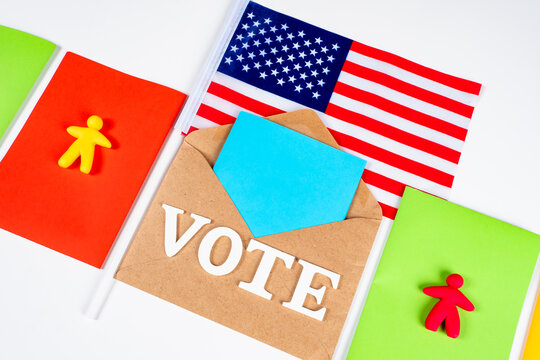 Election of the President of the United States. The word Vote, ballots and the American flag. The concept of voting in elections. A call for Americans to vote in elections.