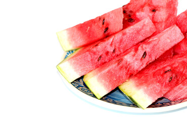 Pieces of juicy ripe sweet natural watermelon on white. Useful vitamins in summer. Seasonal fruits and berries.