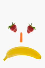 Naklejka premium Unhappy face made up with fruits
