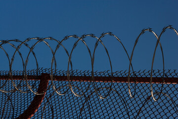 Razor wire and chainlink fence on the bridge, Golden Gate Bridge, San Francisco Bay, San Francisco,...
