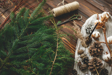 Christmas tree branches and decorations for making rustic christmas wreath at home