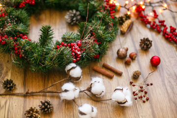 Christmas decorations and Christmas wreath in golden lights