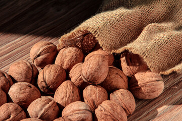 Walnuts are emptied out of the bag. Scattered nuts.