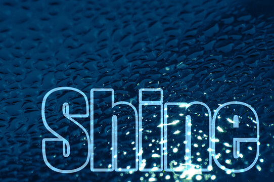The word "shine" on a background of water droplets. Horizontal picture, transparent text.