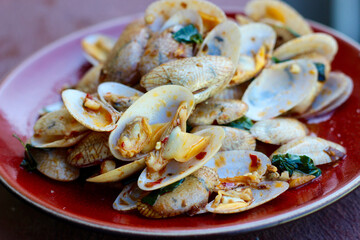 Spicy Thai clams with basil and roasted chilli paste.