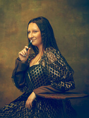 Smoking. Young woman as Mona Lisa, La Gioconda isolated on dark green background. Retro style, comparison of eras concept. Beautiful female model like classic historical character, old-fashioned.