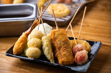 Obraz premium Kushikatsu or Kushiage, japanese Osaka style deep fried skewers